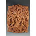 An oriental relief-carved wooden plaque, 49 x 39 cm