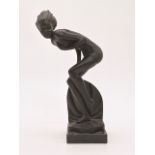 A contemporary statuette of Art Deco influence modelled as a crouched bathing beauty, 25 cm