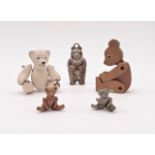 An electroplate rattle in the form of a Teddy bear, two Hantel die-cast miniature articulated