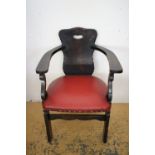 An oak horseshoe-back chair, second quarter 20th Century