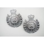 Two Leeds City police cap badges