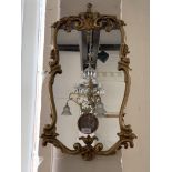 An ornamental gilt mirror, 64 cm