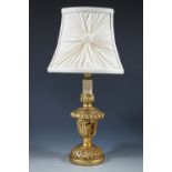 A gilt table lamp and shade