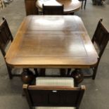 A 1940's oak-draw leaf dining table and four dining chairs (122 x 91 x 76 cm, extended 182 x 91 x 76