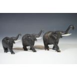 Three carved wooden elephants