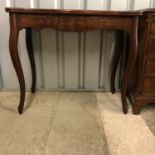 An antique French mahogany turn-over-top tea table