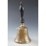 A Victorian brass hand bell with turned ebony handle