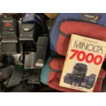 A quantity of camera accessories including flash units, filters etc