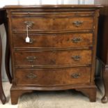 An old reproduction walnut serpentine fronted bachelors chest, 69 x 45 x 77 cm