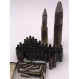 Two inert cannon rounds, cartridge cases, cartridge belt etc.