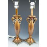 A pair or contemporary gilt columnar table lamps