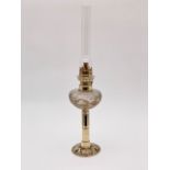 A Victorian glass spigot oil lamp and a brass stand, (latter converted form a "candlestick" postal