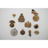 Sundry military badges and sweetheart brooches etc, including a Great War French 75 mm artillery