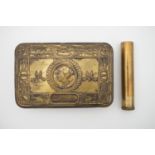 A 1914 Princess Mary gift tin and a Lee Enfield rifle oil bottle