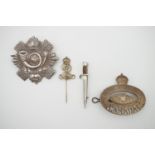 Sundry cap badges, a Bruges bayonet brooch and a stick pin