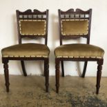 A pair of Victorian turned and carved mahogany standard chairs