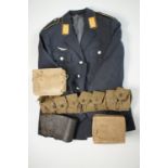 A German air force tunic, two Second World War British civilian gas masks, Home Guard type leather