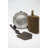 A Great War battlefield-recovered British army entrenching tool, a water bottle and pewter