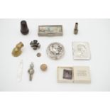 Collectors' items, including the silver front cover from a pocket volume of Lord Tennyson's verse, a