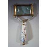 A brass magnifying / reading glass