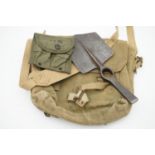 A 1945 British army Pattern 1937 webbing haversack, a US magazine pouch, entrenching tool etc