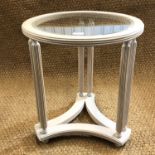 A contemporary glass topped side table, 50 cm diameter, 56 cm high