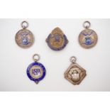 Four 1930s silver Leeds football association prize fobs, and a gilt metal badge, 35.5g weighable