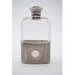 A Victorian silver mounted cut-glass hip flask, with screw cap, having guilloche engraved decoration