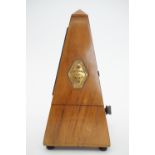 An antique Maelzel metronome, 23 cm