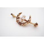 A vintage 9ct gold, garnet and pearl brooch, incorporating a crescent moon device, 3.1g