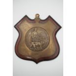 A Memorial Plaque to William Richard John Pepper, mounted on a period shield shaped plaque