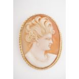 A vintage yellow-metal and carved cameo brooch, depicting the profile of a young lady with