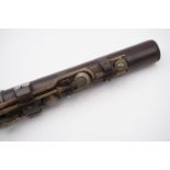 A late 19th Century rosewood flute by Freeman of London, 66 cm