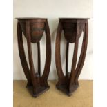 A pair of Art Deco influenced floor standing jardinieres, each having brass-banded turned oviform