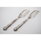 A pair of Victorian silver butter knives, variant King's pattern, with engraved foliate blades,