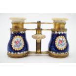 A late of late 19th Century opera glasses, the barrels basse-taille enamelled