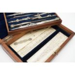 A Victorian cased set of "German silver" drawing instruments, including ivory parallel rule,