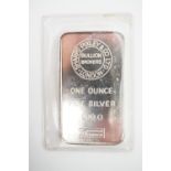 A 1oz white metal ingot, bearing the mark of Sharps, Pixley & Co Ltd, stamped 999.0, (tests as