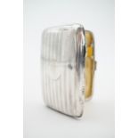 A George V silver cigarette case, of cushion shape with banded decoration, Joseph Gloster,