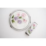 An Elizabeth II guilloche enamelled silver powder compact and matching lipstick holder, hand