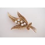 A vintage yellow-metal and pearl brooch, in the form of a budding foliate sprig, stamped '9ct', 3.