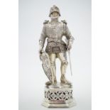 A pair of George V German silver and ivory statuettes modelled as knights probably by B Neresheimer,