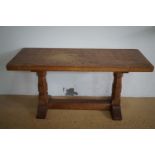 A Robert "Mouseman" Thompson of Kilburn carved oak coffee table, having a rectangular top raised