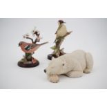 Two Country Artists' figurines, polar bear, and woodpecker on ivy, together with a Border Fine