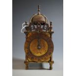 A brass electric lantern clock