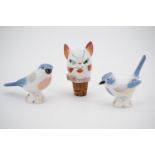 Two small Soviet porcelain birds and a novelty decanter stopper modelled as a cat's head, circa