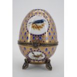A Meander porcelain egg retailed by Hamilton and Inches
