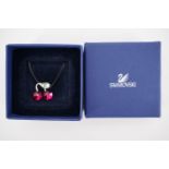 A Swarovski crystal pendant in the form of a bunch of cherries, in original box with papers and tag