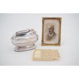 Collectors' items, including a framed photograph of a gentleman, a faux ivory puzzle, and an