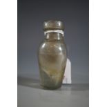 A small antique glass bottle, 7.5 cm